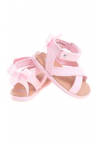 Pink baby sandals fastened around the ankle, UGG